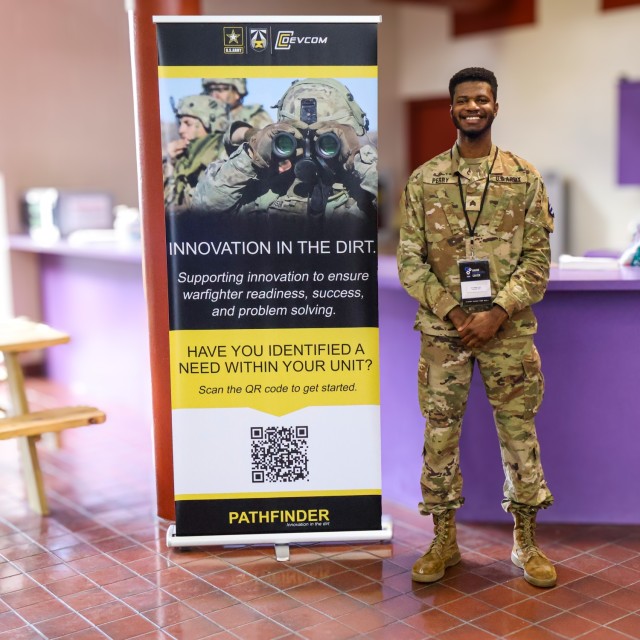 U.S. Army Sgt. Malakhi Perry poses beside a Pathfinder program poster at the Marne Innovation Center during Marne Week on Fort Stewart, Georgia, Nov. 18, 2024. Every year, 3rd ID celebrates Marne Week to highlight the heritage of Dogface Soldiers...
