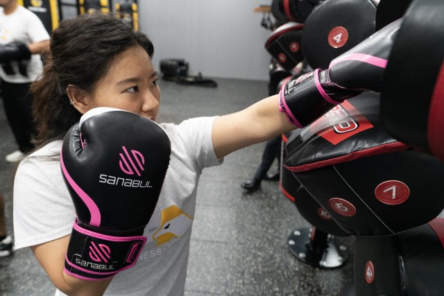 A patron punches a pad at the Camp Carroll Fitness Center, Camp Carroll, Korea, June 6th 2025.