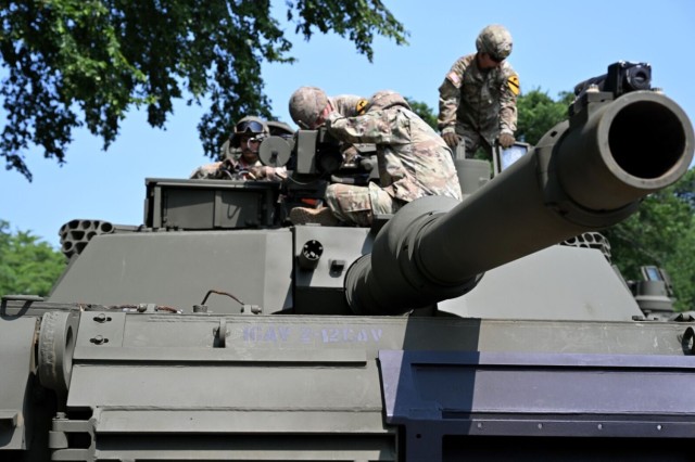 Soldiers assigned to the Army's 1st Cavalry Division from Fort Cavazos, Texas, perform maintenance on an M1A2 Abrams tank during a media preview day at West Potomac Park in Washington, June 11, 2025. The event showcased some of the heavy...