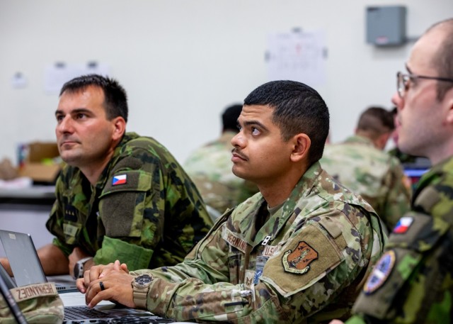 Staff Sgt. Alejandro Hernandez, a digital network exploitation analyst with the 273rd Cyberspace Operations Squadron from the Texas Air National Guard, works together with state partners from the Czech Republic during exercise Cyber Shield 2025 in...