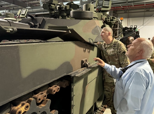 Brig. Gen. John “Brad” Hinson, commanding general of U.S. Army Sustainment Command, inspects an M12A Abrams main battle tank at the Powidz, Poland Army Prepositioned Stocks-2 site, Sept. 18, 2024, alongside site director George Palmer.  As the...