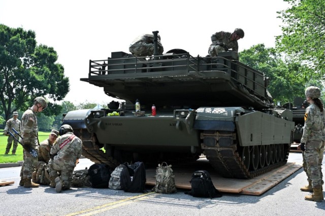 Soldiers assigned to the 1st Cavalry Division from Fort Cavazos, Texas, perform maintenance on an M1A2 Abrams tank during a media preview day at West Potomac Park in Washington, June 11, 2025. The event showcased some of the heavy equipment and...