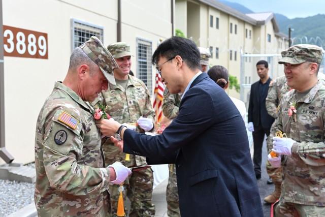 U.S. Army Brig. Gen. Sean Crockett, Acting Commander, Eighth Army, pins on a lapel flower during a ribbon cutting ceremony held on Camp Hovey to re-open the Rotational Stryker Brigade Headquarters building, June 16, 2025. The building received a...