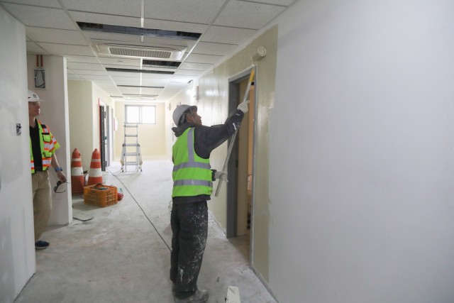 A contractor paints a wall inside Building S-3889 on Camp Hovey, May 14, 2025. The building received a $2.2 million update aimed at expanding the operational capabilities of the building while simultaneously improving Quality of Life (QoL) for its...