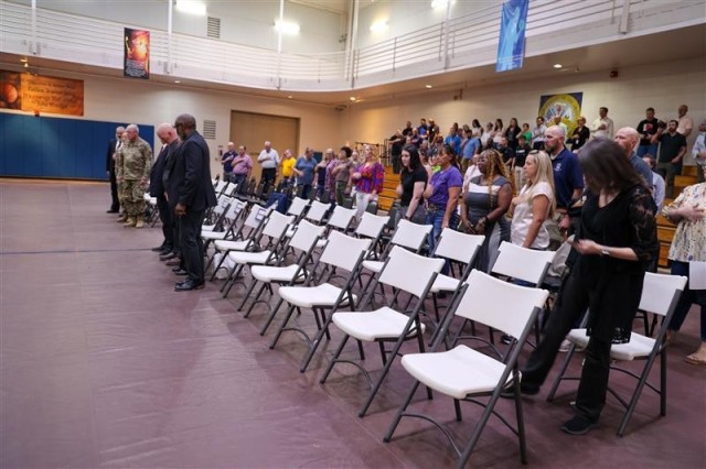 The Dugway workforce standing for the playing of the National Anthem as the ceremony begins.