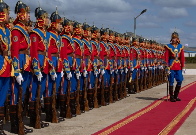 Armed Forces of Mongolia service members assigned to the Mongolia Honor Guard, stand at attention during the opening session for Khaan Quest 2025, at Five Hills Training Area in Mongolia, June 14, 2025. Khaan Quest is an annual, multinational and...