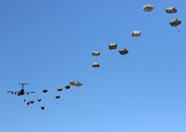 Paratroopers assigned to 1st Brigade Combat Team, 82nd Airborne Division fill the skies over a drop zone in Torun, Poland during Exercise Swift Response 16, June 7. Exercise Swift Response 16 is one of the premier military crisis response training...