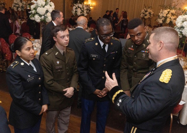 Far right - Maj. Gen. John T. Reim, Picatinny Arsenal Commanding General and Joint Program Executive Officer for Armaments and Ammunition, speaks with guests at Picatinny Arsenal's 250th Army birthday celebration.