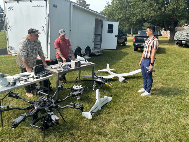 RTI representatives demonstrate some UAS capabilities to a young festival goer