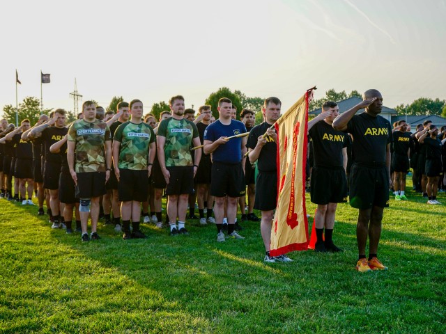U.S. Army Soldiers with Headquarters Support Company, U.S. Army Garrison Wiesbaden, and German Soldiers with Landeskommando Hessen present arms ahead of a post run held in honor of the U.S. Army’s 250th anniversary, organized by U.S. Army...