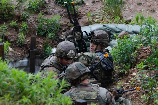 U.S. Army 1st Lt. Andrew Judge, a platoon leader assigned to Charlie Company, 1st Battalion, 125th Infantry Regiment, Michigan Army National Guard, leads his squad through a trench system during Exercise Baltic Viking near Alūksne, Latvia, June...
