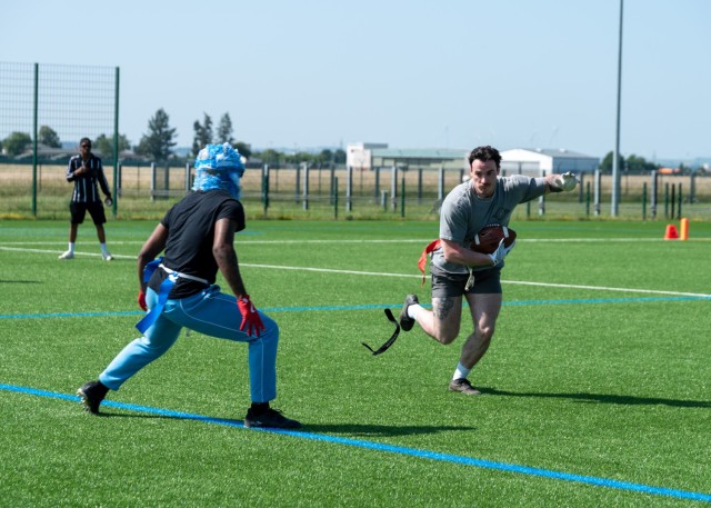 U.S. Army Soldiers face off during a flag football game held as part of the U.S. Army Garrison Wiesbaden’s Commander’s Cup Sports Tournament on Lucius D. Clay Kaserne, Wiesbaden, Germany June 12, 2025. 
...