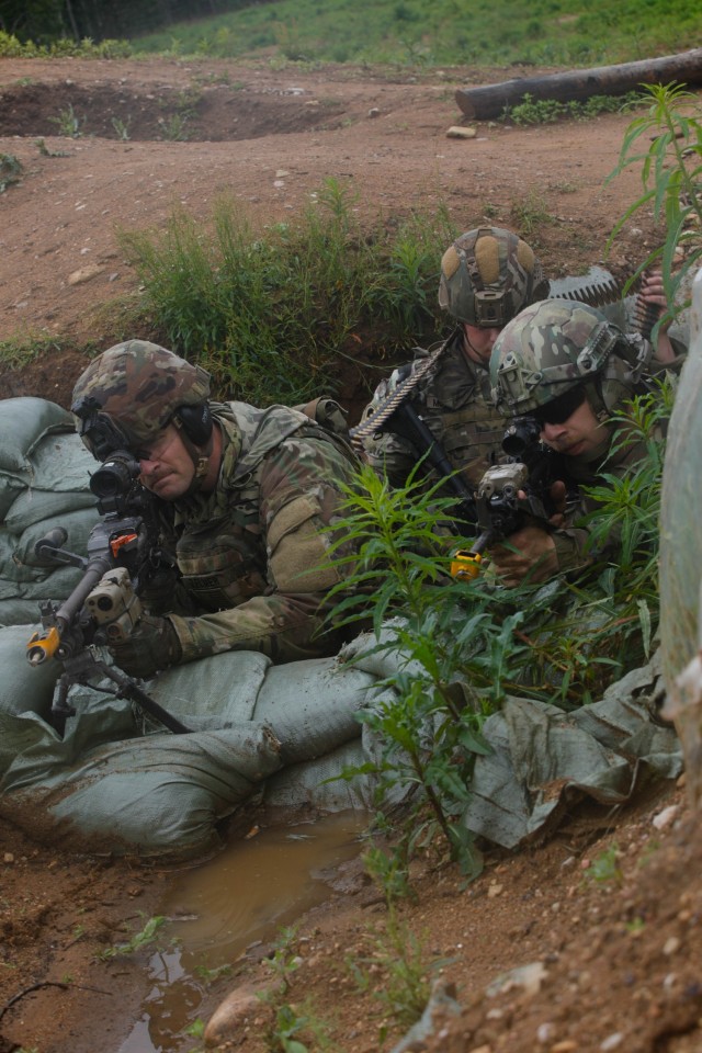 U.S. Army Spc. Justin Zelmer (left), Spc. Tristan Mohrland, (middle) and Spc. Noah Simon, grenadiers assigned to Charlie Company, 1st Battalion, 125th Infantry Regiment, Michigan Army National Guard, suppressed fire during Exercise Baltic Viking...