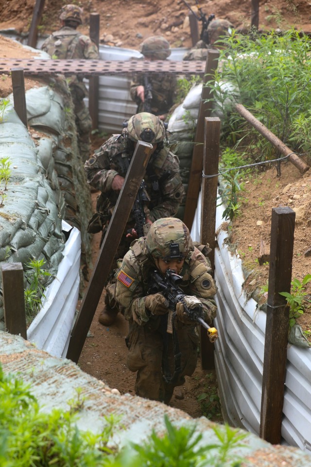 U.S. Army soldiers assigned to Charlie Company, 1st Battalion, 125th Infantry Regiment, Michigan Army National Guard, tactically maneuver through a system of trenches during Exercise Baltic Viking near Alūksne, Latvia, June 8, 2025. The...