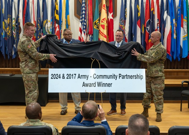 During the Army Community Partnership Award recognition event June 13 in Lincoln Hall Auditorium, (from left) Maj. Gen. Christopher Beck, Fort Leonard Wood and Maneuver Support Center of Excellence commanding general; Sean Wilson, Waynesville...