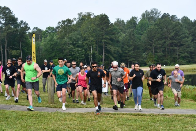 Runners take off to begin the Army 250th Birthday 5K run/walk at Fort A.P. Hill