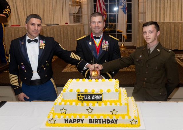 From left - Command Sgt. Maj. David M. Franks, Maj. Gen. John T. Reim, Picatinny Arsenal Commanding General and Joint Program Executive Officer for Armaments and Ammunition, and Cadet Hamilton, cut the Army's 250th birthday cake.