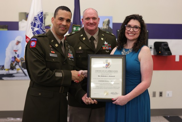 Col. Phillip P. Murrell (left), Kathrine Richmond (right) and Maj. Casey D. Richmond (center)