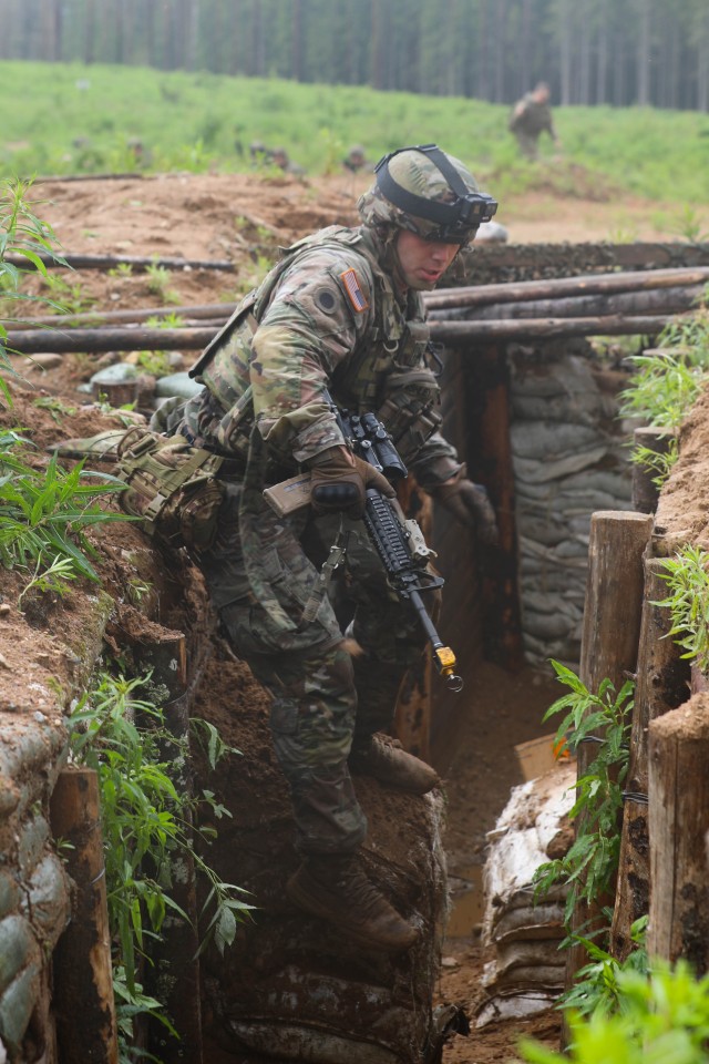U.S. Army Sgt. Ashley Skylar, a team leader assigned to Charlie Company, 1st Battalion, 125th Infantry Regiment, Michigan Army National Guard, jumps into a trench during Exercise Baltic Viking near Alūksne, Latvia, June 8, 2025.  Baltic Viking is...