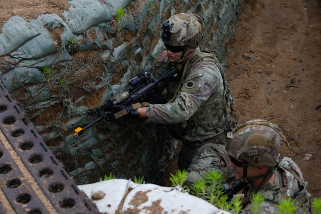 U.S. Army soldiers assigned to Charlie Company, 1st Battalion, 125th Infantry Regiment, Michigan Army National Guard, maneuver through the trenches during Exercise Baltic Viking near Alūksne, Latvia, June 8, 2025. Large-scale Combat Operations...