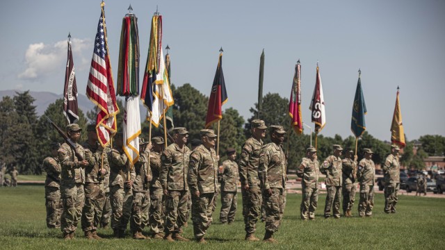 Maj. Gen. Patrick Ellis, commanding general of the 4th Infantry Division and Fort Carson, Maj. Gen. David Doyle, outgoing commanding general for the division, and Lt. Gen. Kevin Admiral, commanding general of III Armored Corps and Fort Hood, stand...