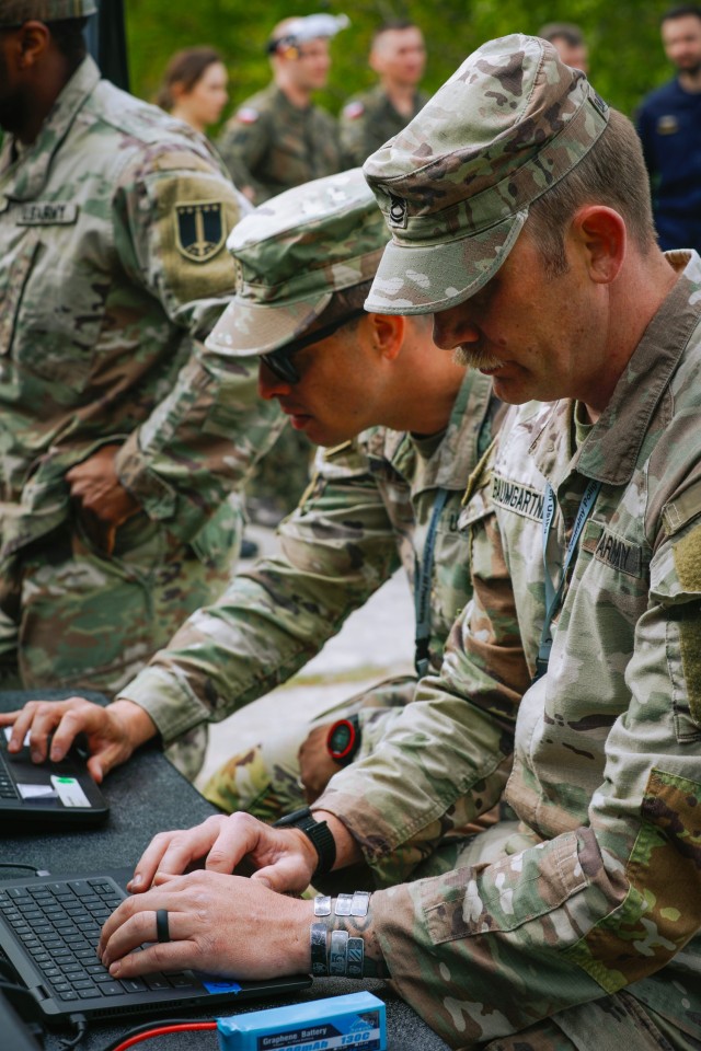 U.S. Army Sgt. 1st Class Andrew Baumgardner, 2nd Multi-Domain Task Force, checks in-flight data of an experimental Unmanned Aerial Vehicle (UAV) during the flight, crash and recovery stress-test portion of 2nd Multi-Domain Task Force led exercise...
