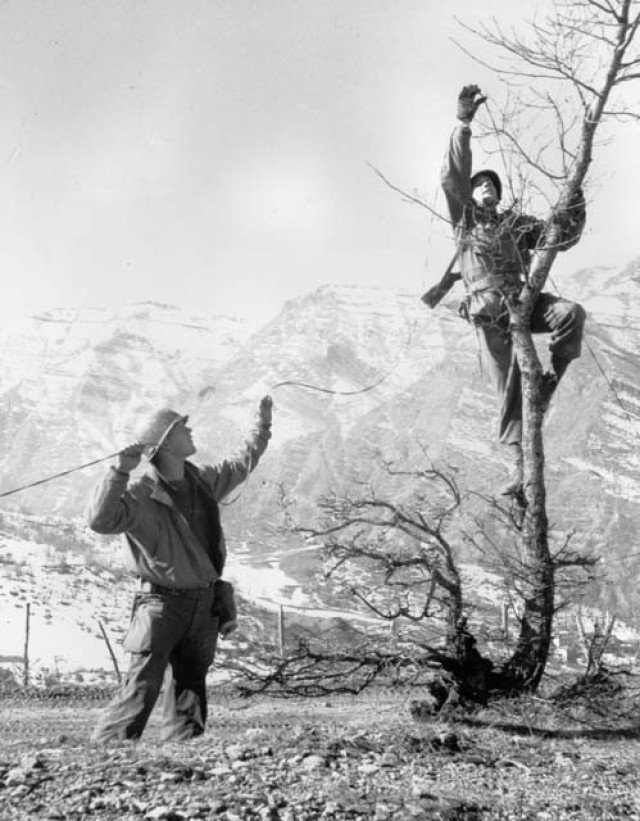 Signal Soldiers at work near Mount Belvedere, during the Italian campaign, World War II. (NARA photo)