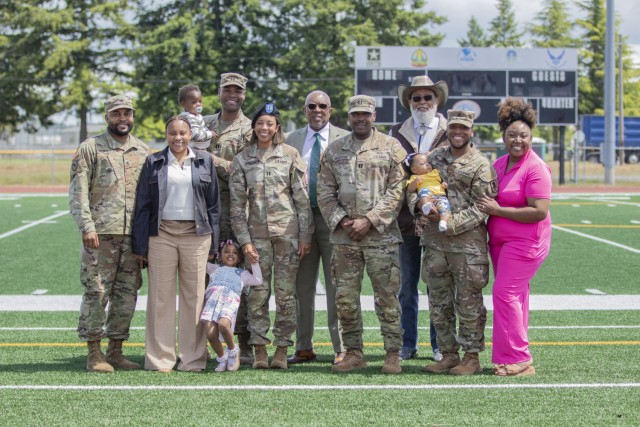 Capt. Aubrey A. Casey, commander of Alpha Company, 51st Expeditionary Signal Battalion Enhanced , poses with her family following the company’s change of command ceremony at Joint Base Lewis-McChord, Washington, May 28, 2025. Her family, service...