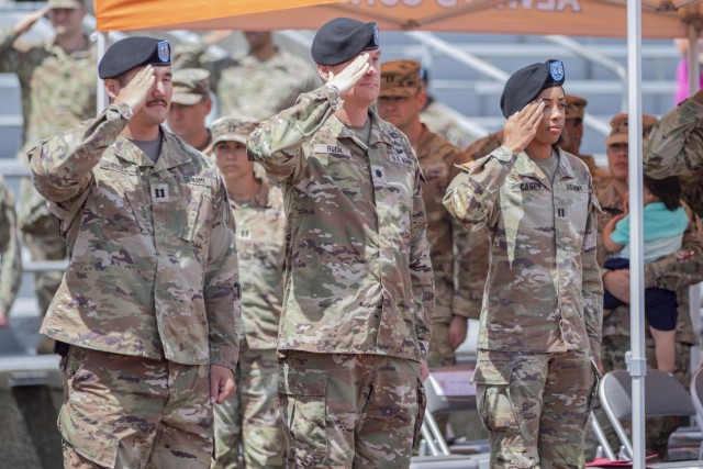 Lt. Col. Nicolas Beck, commander of the 22nd Corps Signal Brigade, Capt. Aubrey A. Casey, commander of Alpha Company, 51st Expeditionary Signal Battalion Enhanced, and Capt. John P. Stoll prepare to march for the official guidon exchange during...