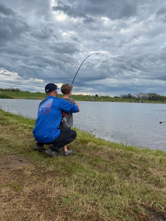 A father and son cast a reel during the Fort Sill’s 39th annual Kids Fishing Derby.