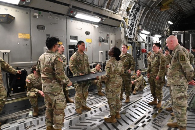 109th and 105th Critical Care Air Transportation Teams provide litter training on board a C-17 Globemaster.