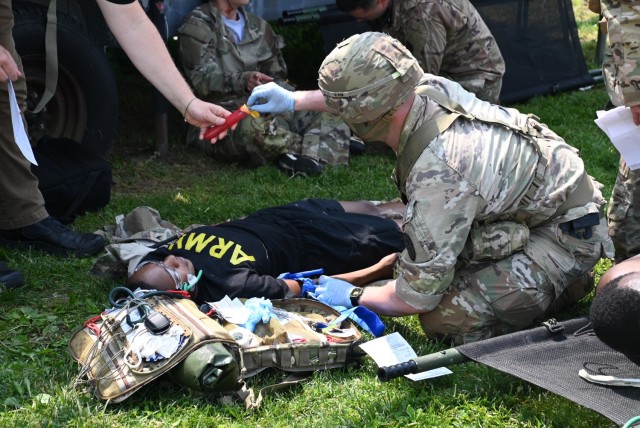 Soldiers, Marines, and Airmen, in moulage, replicated wounded military members, as both Air Force and Army medics treated the injured and prepared them for transport.