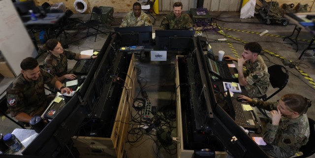 Allied planners use Virtual Joint Operations Center (VJOC) and the Multi-Agent Virtual Environment (MAVEN) to track movements and communicate with units across the battlefield during Warfighter Exercise 25-4