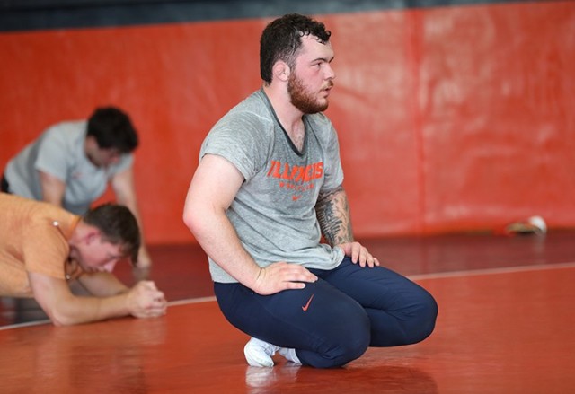 Spc. Joe Braunagel pauses for a moment during wrestling practice at the University of Illinois Urbana-Champaign, June 17, 2025. Braunagel’s commitment to physical and mental toughness has been shaped by his service with the Illinois Army...