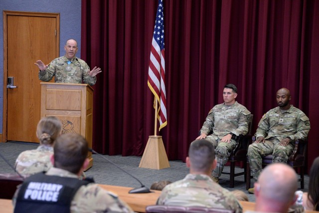 Guest speaker Midwest Joint Regional Correctional Facility Battalion (Corrections) Command Sgt. Maj. Travis Huggard talks about the process to become a Sergeant Audie Murphy Club member during the SAMC induction ceremony for Kennel Master Sgt. 1st...