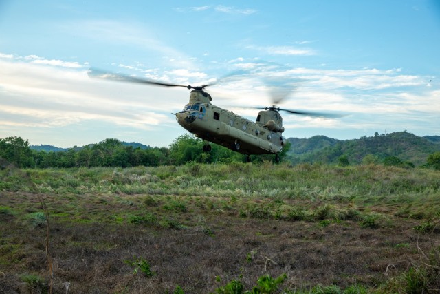 U.S. Army Soldiers assigned to the 2-25th Aviation Regiment, 25th Combat Aviation Brigade, 25th Infantry Division land a Boeing CH-47 full of soldiers from the Philippine Army’s 7th Infantry Division during an air assault maneuver as part of the...