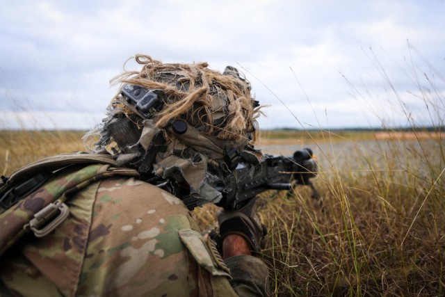 A 4th Infantry Division Soldier aims his weapon during a recent training exercise.
