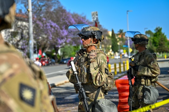 U.S. Army Soldiers with 1st Battalion, 184th Infantry Regiment, California Army National Guard, stand guard outside the Wilshire Federal Building in Los Angeles, June 22, 2025. The Soldiers provided perimeter security alongside U.S. Marines as...