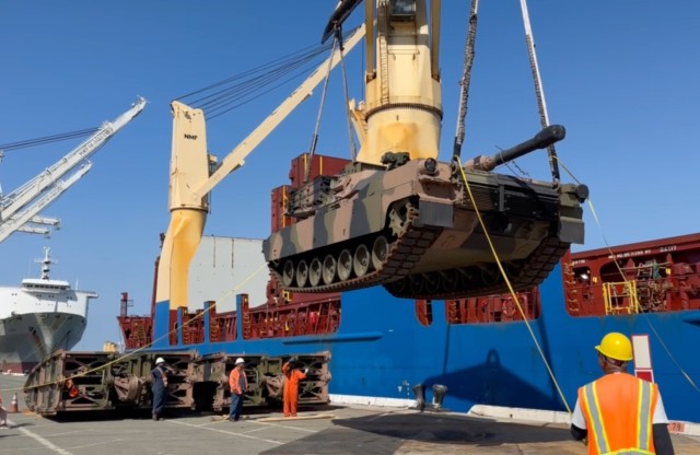 An M1A3 Tank is loaded from the Port of Oakland, Calif. to the vessel Allied Brooklyn on June 21, 2025. The tank is painted in Australian camouflage and was purchased from the U.S. Foreign Military Sales program. Photo by Capt. Ryan Garofalo,...