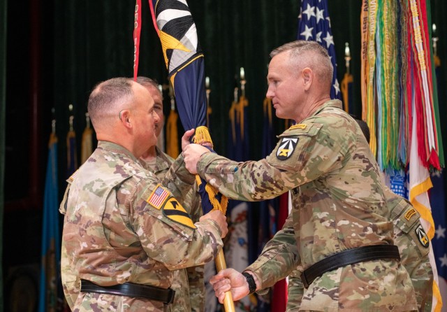 Maj. Gen. John Cushing, the U.S. Army Combat Capabilities Development Command, or DEVCOM, outgoing commanding general, right, passes the DEVCOM guidon to Lt. Gen. Miles Brown, the Army Futures Command deputy commanding general, June 27, 2025, at...