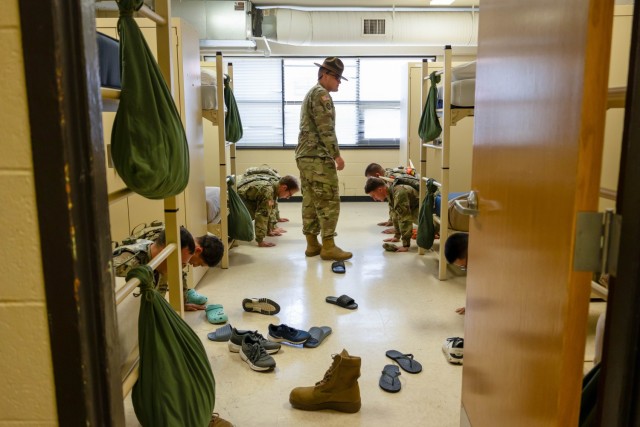 Cadets from 1st Regiment, Basic Camp spend the afternoon conducting hip pocket training at Fort Knox, Kentucky, July 3, 2024. Cadets were instructed on how to set up their fighting load carrier (FLC).