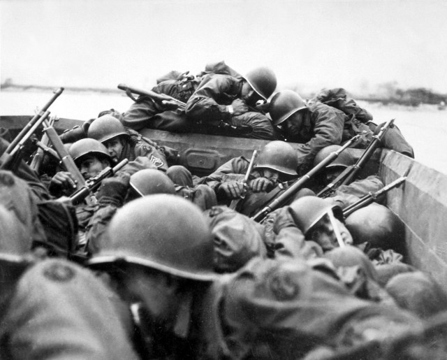 One of the most iconic photos of WWII, Soldiers of the 89th Infantry Division cross the Rhine River in assault boats, March 1945.