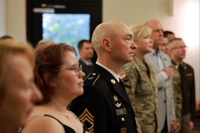 Master Sgt. Thomas C. Holk (third from left) and his wife Alicia Holk (second from left)