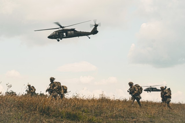 U.S. Soldiers assigned to the 173rd Airborne Brigade walk away from the drop zone during Saber Junction 24 at the Hohenfels Training Area, Joint Multinational Readiness Center (JMRC), Germany, Sep. 4, 2024....