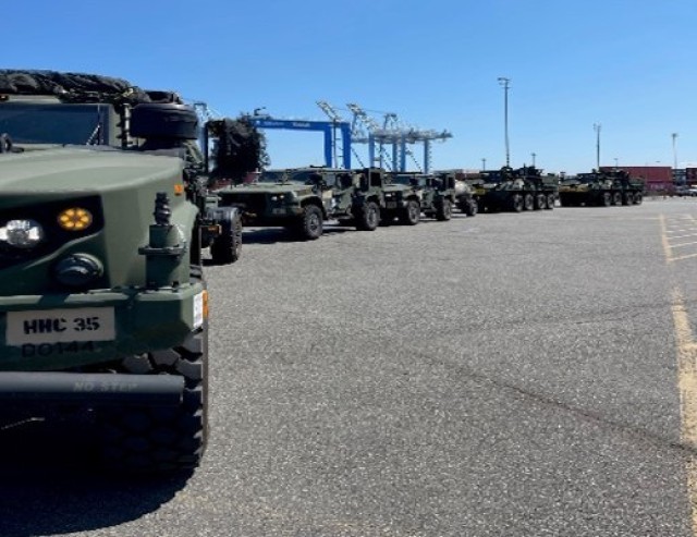 Military vehicles are lined up in July 2023 during load-out operations in preparation  for a deployment. (Photos courtesy of the 833rd Transportation Battalion)