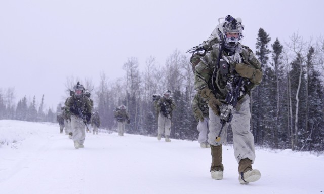 U.S. Army Soldiers assigned to 3rd Battalion, 509th Parachute Infantry Regiment, 2nd Infantry Brigade Combat Team (Airborne), 11th Airborne Division walk towards their next objective during Joint Pacific Multinational Readiness Center 25-02 in...
