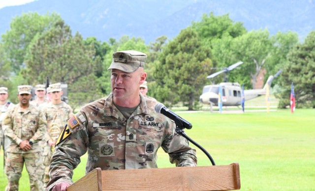 Command Sgt. Maj. Travis A. Manuel, the Command Sergeant Major of Fort Carson addresses the crowd at the U.S. Army Garrison Fort Carson Change of Responsibility ceremony June 27, 2025 at Founders’ Field on Fort Carson.
