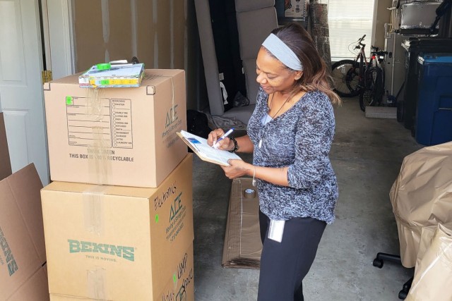 Tressi Werdebach, Army Personal Property Lead Element quality assurance inspector, checks packing quality and inventory items at an inspection, July 19, 2024.