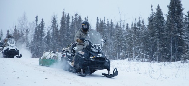 U.S. Army Soldiers assigned to 3rd Battalion, 509th Parachute Infantry Regiment, 2nd Infantry Brigade Combat Team (Airborne), 11th Airborne Division, drive snowmobiles carrying supplies during Joint Pacific Multinational Readiness Center in the...