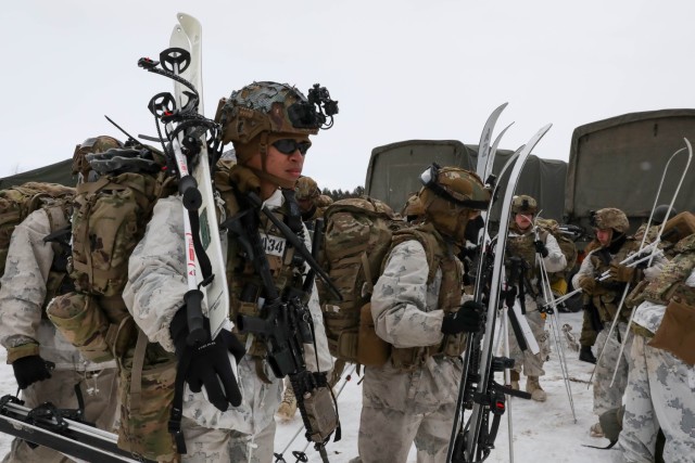 U.S. Army Soldiers from the 1st Battalion, 5th Infantry Regiment, unload gear in preparation for downhill ski maneuvering during North Wind 25 with members of the 18th Infantry Regiment, 11th Brigade, Northern Army, Japan Ground Self Defense...